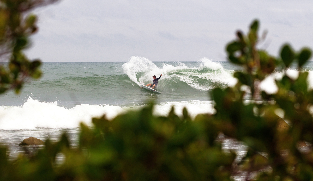 Ricky spotting some gold on the reef below. Photo: <a href=\"http://www.gregewingphoto.com/\"> Greg Ewing</a>