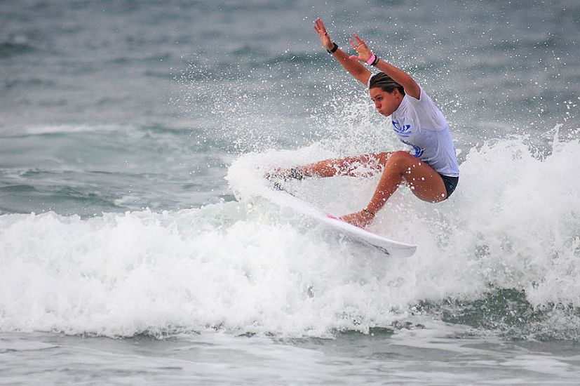 ISA China Cup Women\'s Open Division winner Philippa Anderson slashes her way to victory. Photo: ISA/Tweddle 