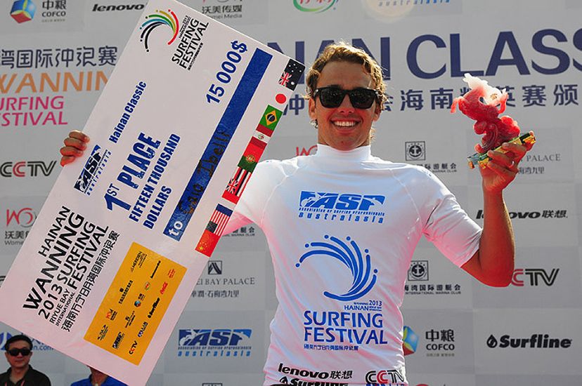 Caio Ibelli showing off the beautiful first place trophy, a hefty check, and a winning smile. Photo: ISA/Tweddle