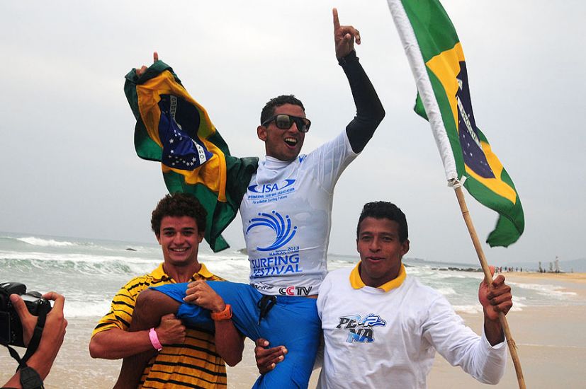 The young Brazilian champ getting chaired up the beach. Photo: ISA/Tweddle