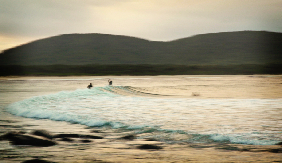 A wave between friends into the sunset. Photo: <a href=\"http://www.instagram.com/hollytreephoto\">@HollyTreePhoto</a>