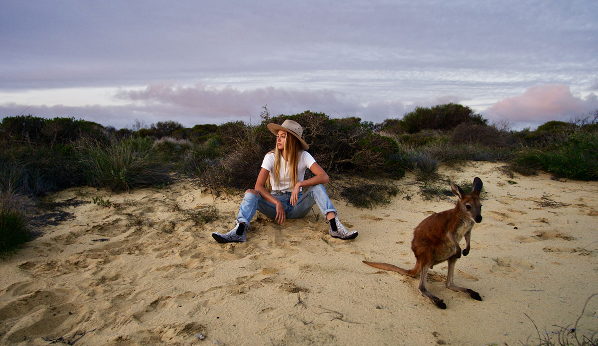 Imogen and Ziggy, her family’s kangaroo. Living as remotely as the Caldwell’s do, stray kangaroos that are abandoned by their parents often find their way onto their property whilst looking for food and water, before quickly becoming situated and relishing the human interaction.  Photo: <a href=\"http://www.morganmaassen.com/\">Morgan Maassen</a>