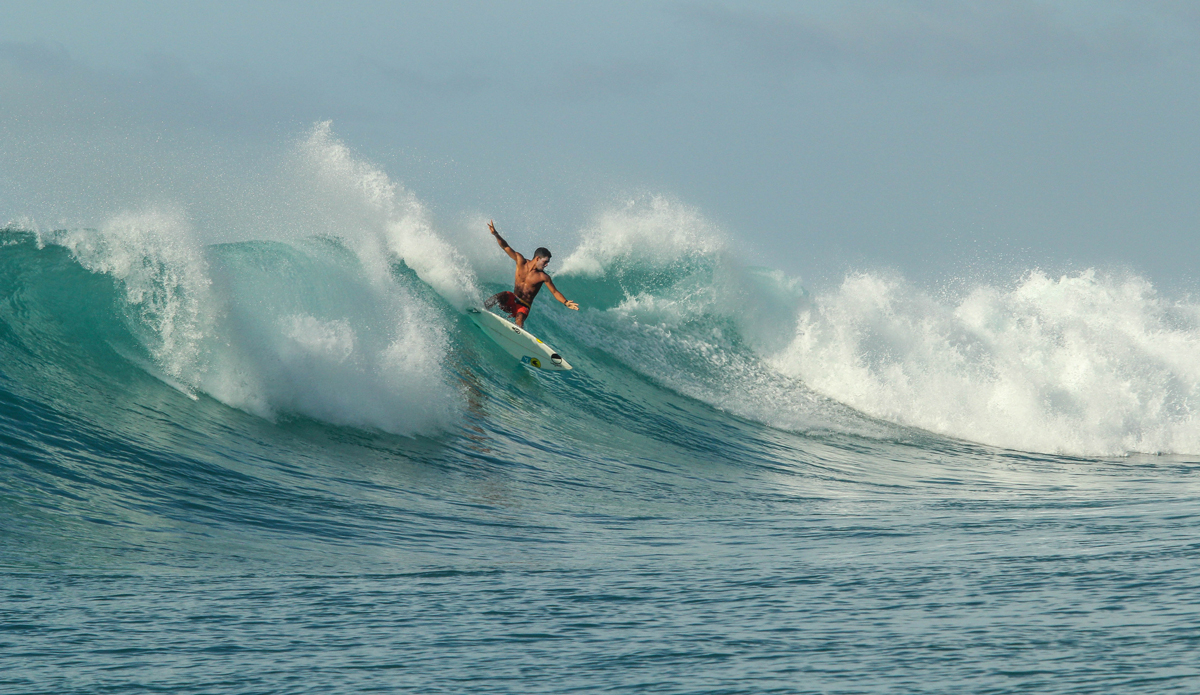 On this wave, I learned to never take the first wave of the set. After a round-house I set my rail and committed to this turn. I had to straighten out and \'pancaked it\' on to shallow water. After this wave there were 7 more behind it increasing in size, and I took all of them on the head. After each wave I got pushed closer and closer to shore, where soon I would be on dry reef. I managed to get back out without any cuts, but I was pushed all the way from the point, to where our boat was anchored. Photo: Courtesy of Hunter Jones