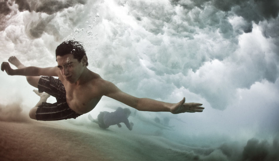 Escape. A young man stretches out to avoid the wave breaking above at Coogee Beach, Sydney. 
“The first from the underwater series, we were all caught inside by a set. Almost subconsciously, I turned the camera on the swimmers, and it turned out to be a good thing. The next wave punished me and ripped the leash off my wrist, sending the housing into the shorey somewhere - by the time I retrieved it, the swimmers had bailed, and I never got his name.\" Photo: <a href=\"http://www.marktipple.com/\" target=_blank>Mark Tipple</a>.