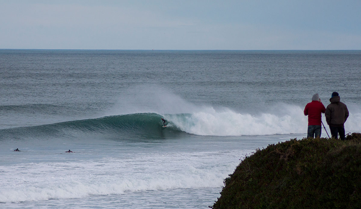 Esteban Hermida getting piped at home. Angel Fotosplino, foreground, is the most important photographer of the south coast seen here making a visit to the northern reaches. Photo: Irene Aneiros