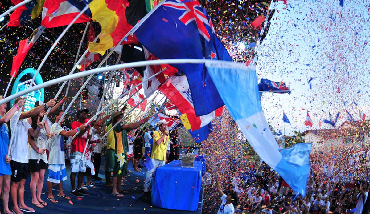 A gathering of surfing nations, the Opening Ceremony for any ISA World Championship is a spectacle to behold. ISA President Fernando Aguerre (pictured) declaring the event officially open, after all nations have poured their sands in the Sands of the World Ceremony, symbolizing the peaceful union of the world through surfing. Photo courtesy of <a href=\"http://www.isasurf.org/\">ISA Archive</a>