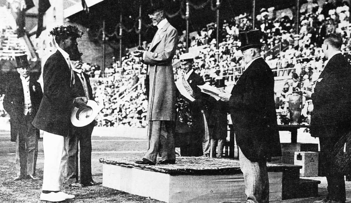 In Duke we trust. The great Duke Kahanamoku, father of modern surfing, receiving a Gold Medal in swimming at the 1912 Olympic Games. From Duke’s autobiography from 1966: “Even as early as that date, I was already thinking of surfing in terms of how it could someday become one of the events in the Olympic Games. Why Not? I still believe surfing will one day be recognized, voted and accepted.” As the ISA looks towards realizing the dream of surfing as an Olympic sport, there is inspiration to be found in what Duke accomplished more than a hundred years ago. Photo courtesy of <a href=\"http://www.isasurf.org/\">ISA</a>