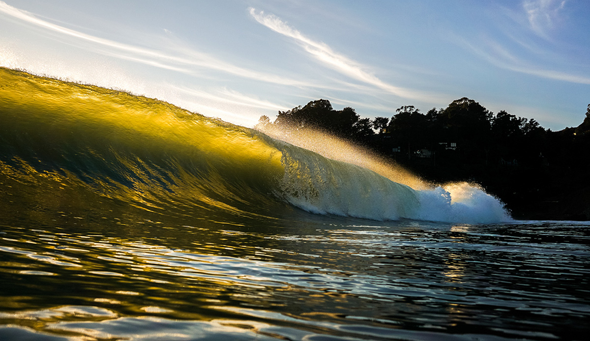 A beautiful backlit evening at a pretty epic wedge in Marin County, California. This night had a negative low tide which meant I was standing knee high with these bombs rolling through. Photo: Jack Bober