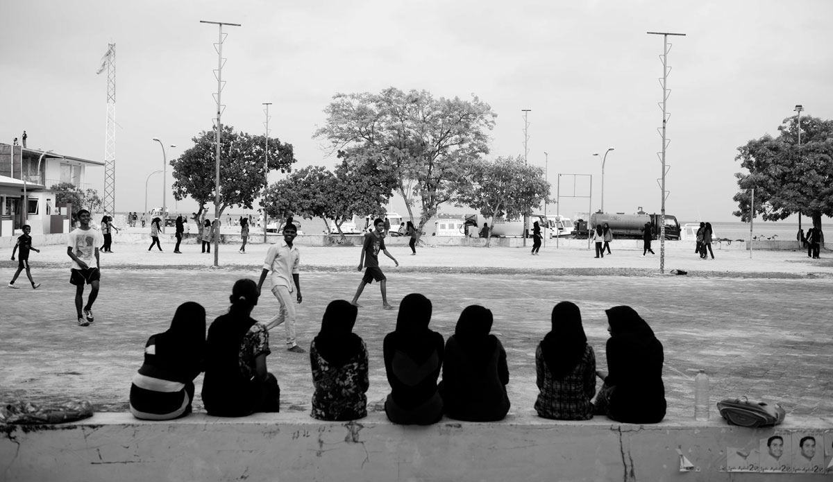 Local Thinadhoo girls watching on as the boys play soccer before holy day (friday) where the town comes to a halt. Photo: <a href=\"http://www.jackdekortphoto.com.au/\">Jack Dekort</a>