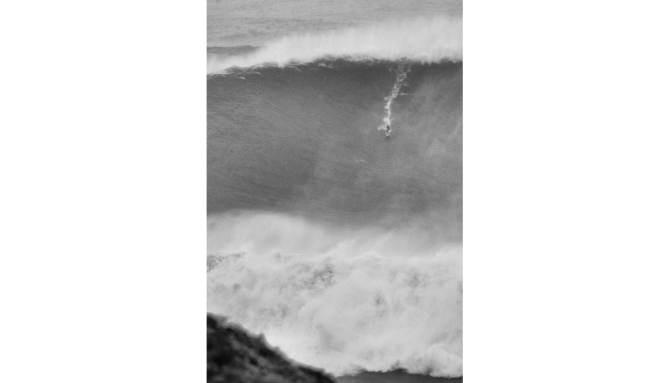 As I decided to take a tight shot, the biggest wave ever surfed turned up and Carlos Burle surfed it just after saving Maya from certain death. Photo: <a href= \"http://joaobracourt.com/\" target=_blank>Joao Bracourt.</a>