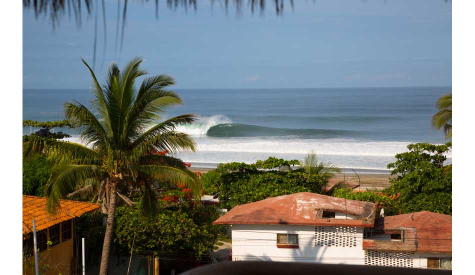 I ran up to a lookout to see if it was clean enough to make a break for it. This is some deceptive perfection although there was one incredible three wave set. Photo: <a href=\"http://www.hungrywalrus.com/\" target=_blank>John Maher</a>