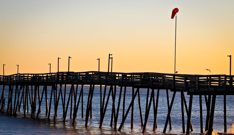 Valentine\'s Day morning in North Carolina was the polar opposite of the previous day, which saw dark-and-stormy set waves scraping the bottom of Avalon Pier, pictured here. The combination of hard offshore winds and the rapidly exiting low translated to small -- but perfectly groomed -- surf. So life goes on the East Coast. Photo: Shaun Devine.