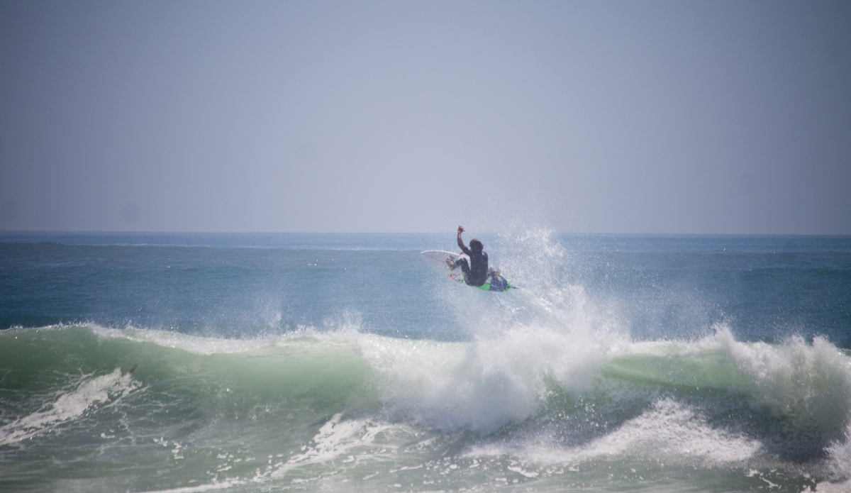 Julian Wilson taking flight in pumping Orange County surf. Photo: <a href=\"http://www.studiopierce.com/about/\">Josh Pierce</a>