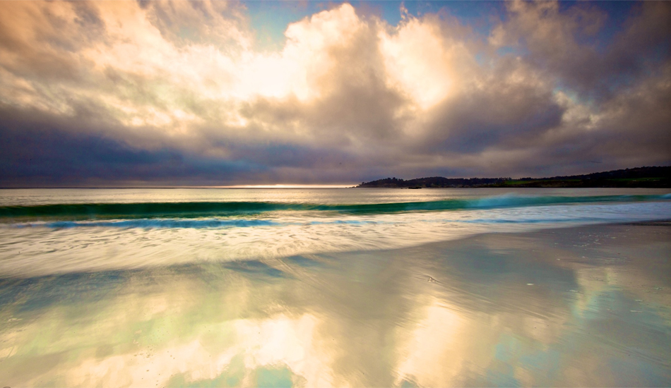 Carmel California, Sunset just passed and the sky was still bright enough to capture the reflections off the sand.  Image: <a href=\"http://gokenji.com/port/\" target=\"_blank\">Croman</a>