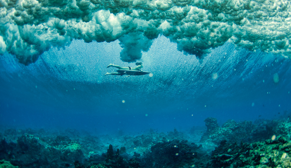 Carissa Moore sneaking under one in Micronesia. Image: <a href=\"http://www.jrkenworthy.com/\" target=\"_blank\">Kenworthy</a>