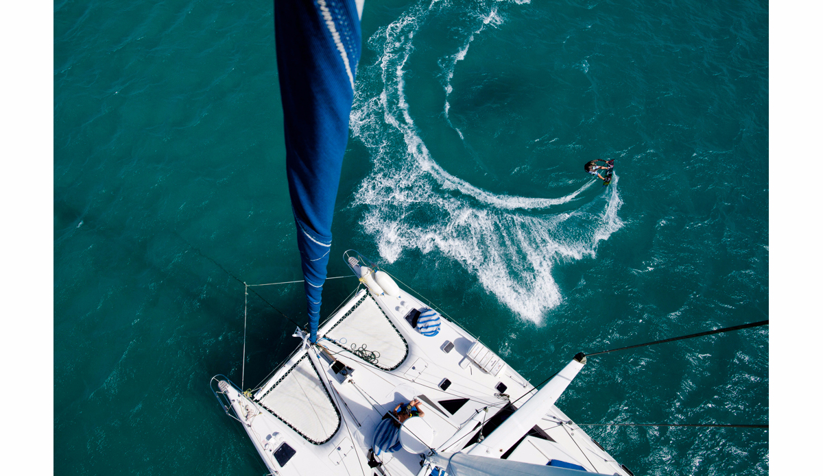 Brett Wright carves through the crytal waters off Eagle Island whilst kite surfing on the Great Barrier Reef, Australia. Photo: <a href=\"https://instagram.com/krystlejwright/\">Krystle Wright</a>