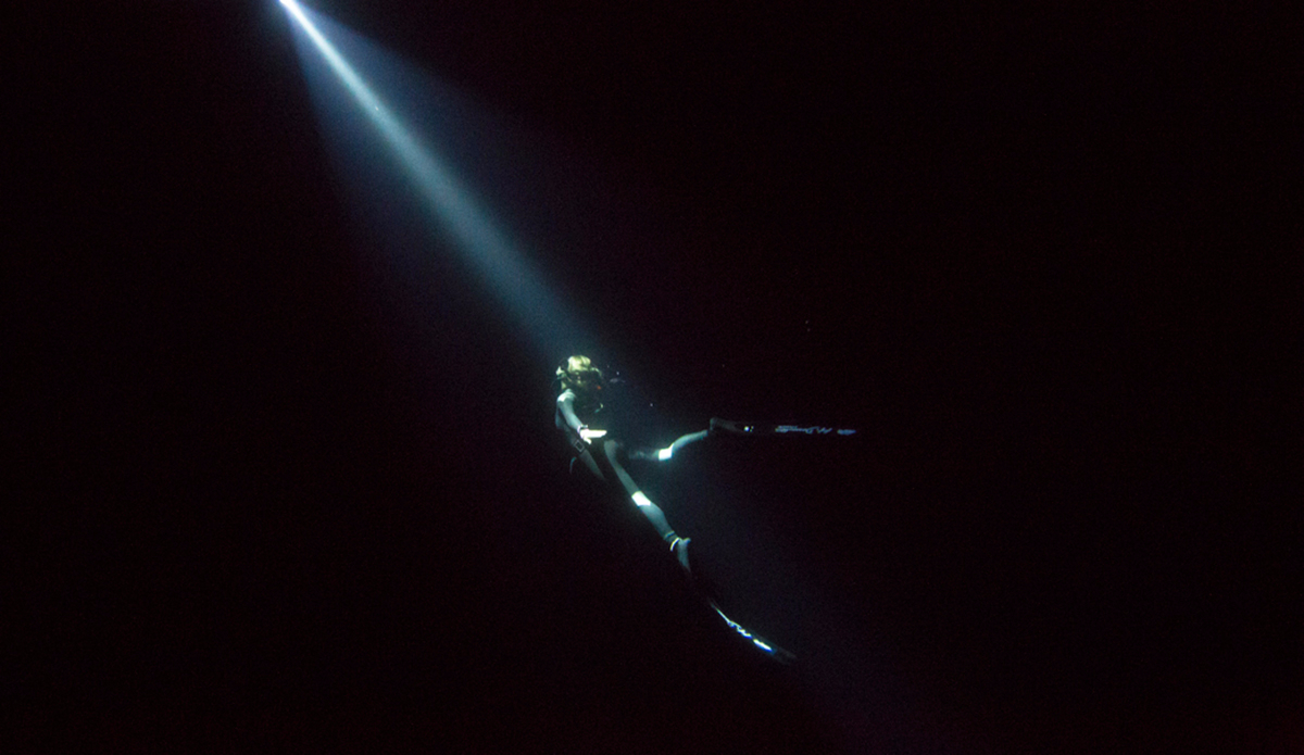 Francine Kreiss freedives off the east coast of Sardinia in Italy at night with only a torch for guidance. Photo: <a href=\"https://instagram.com/krystlejwright/\">Krystle Wright</a>