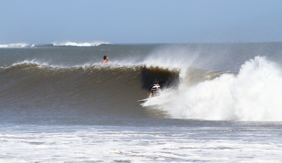 Ben Bourgeois. Ben was completely plugged in with ocean’s energy while surfing Oregon Inlet.You can see the outer shoals breaking in the distance. Image: McCarthy