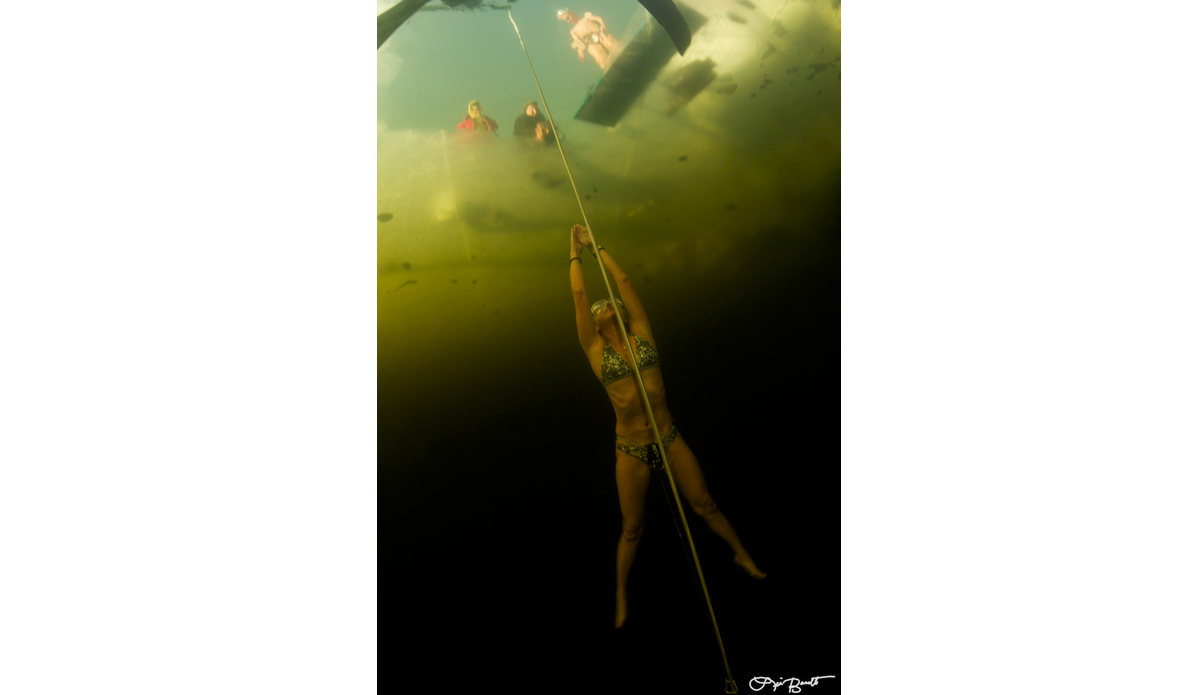 Freediver Tomoka Fukuda doing a no-ﬁns dive under ice. Photo: <a href=\"http://liabarrettphotography.com/\" target=_blank>Lia Barrett</a>