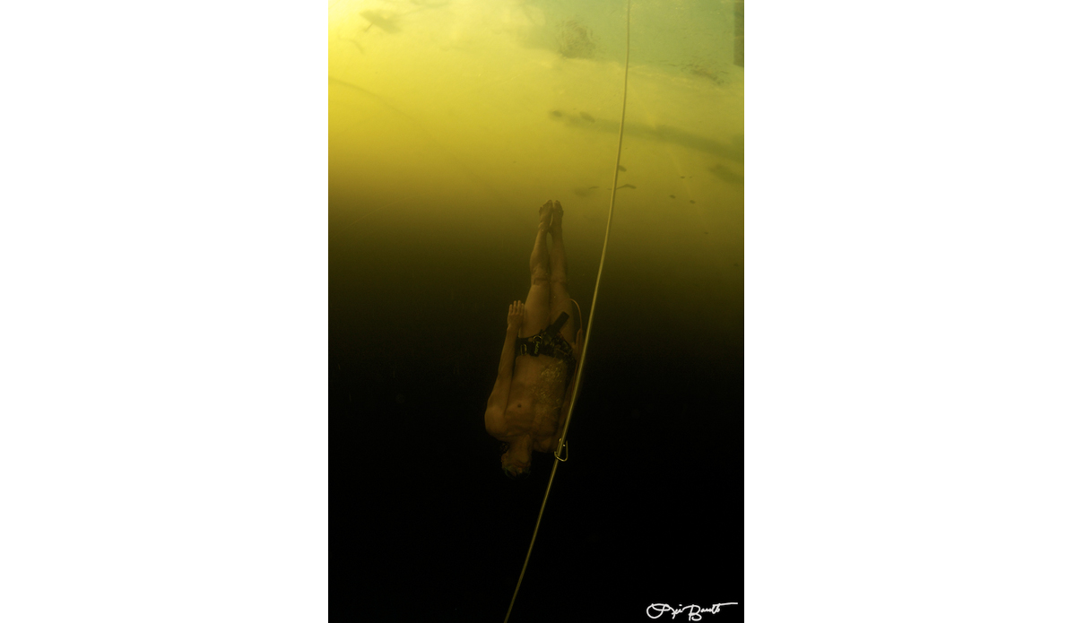 World Record under ice holder Stig Severinsen doing a no-ﬁns dive with a 
Speedo on. Photo: <a href=\"http://liabarrettphotography.com/\" target=_blank>Lia Barrett</a>