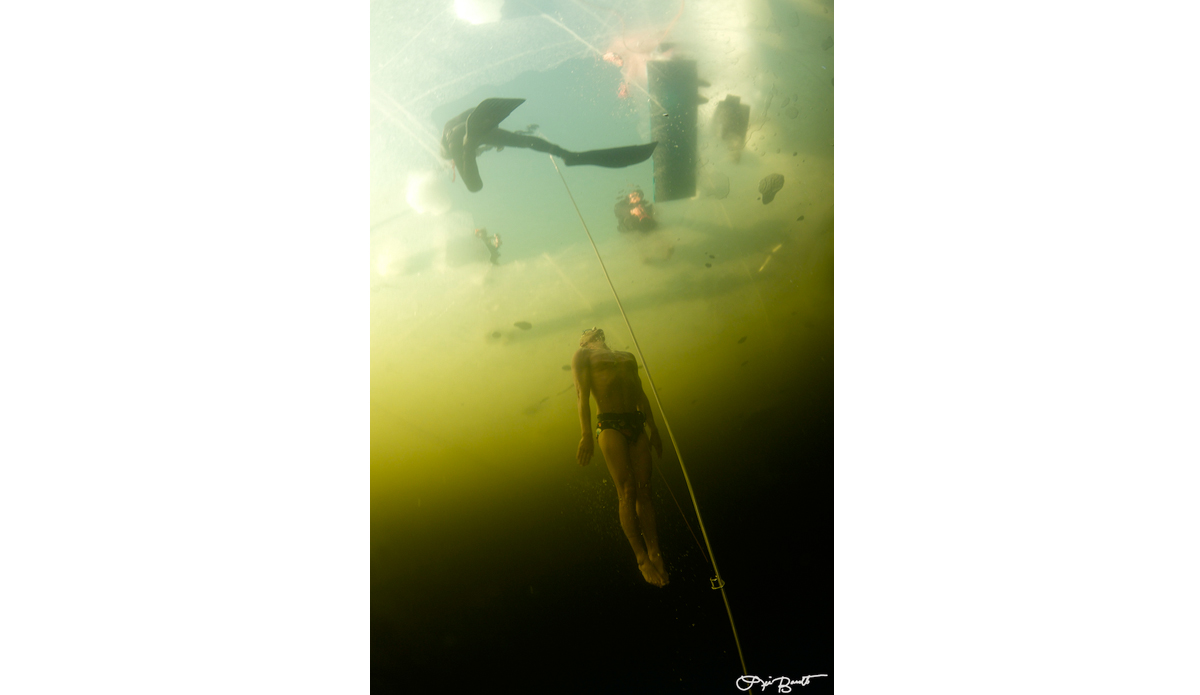 World Record under ice holder Stig Severinsen doing a no-ﬁns dive with a 
Speedo on. Photo: <a href=\"http://liabarrettphotography.com/\" target=_blank>Lia Barrett</a>