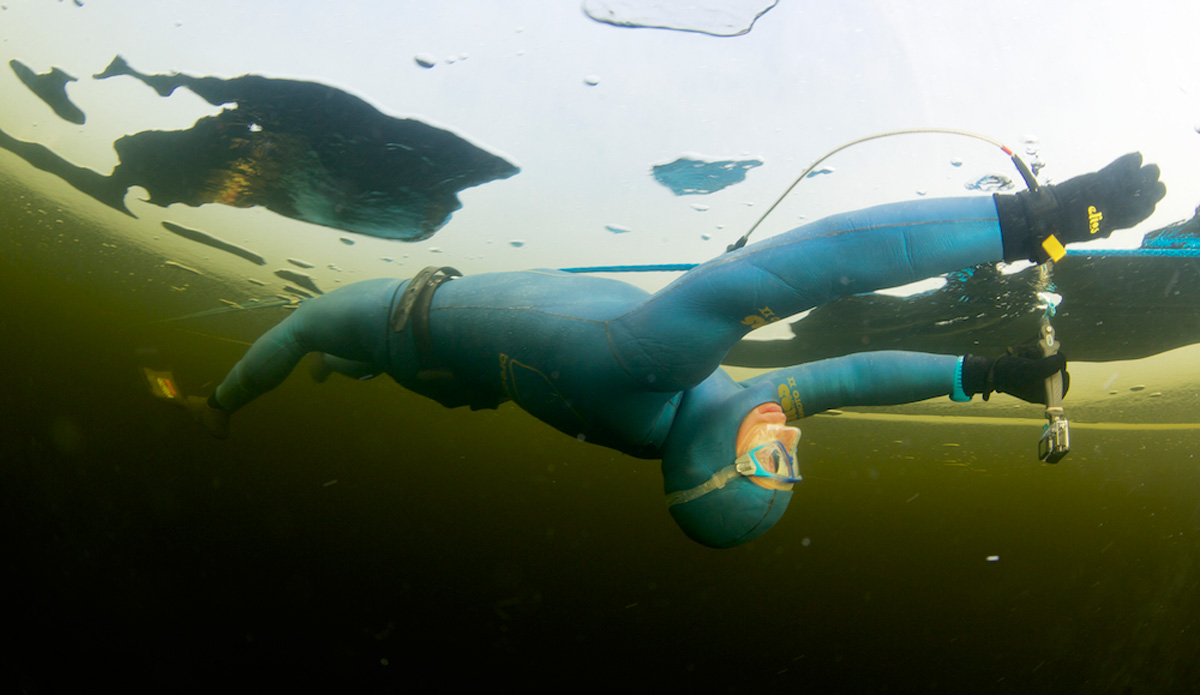 Stig Severinsen, World Record holder under ice, ﬁlms his dive with a GoPro. Photo: <a href=\"http://liabarrettphotography.com/\" target=_blank>Lia Barrett</a>