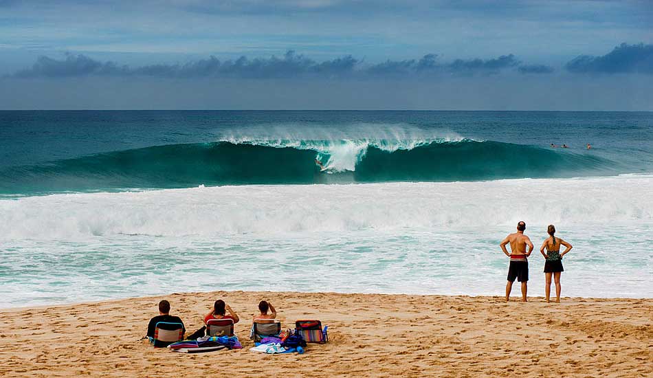 This winter was my first time posting up in Hawaii for the season as a photographer. While out there, I thought long and hard about the images I wanted to create and the stories I wanted to highlight. The culture clash between the surfing pilgrimage and the middle-America vacationers was an angle I took a lot of interest in. Here\'s Julian pulling into a set at Off The Wall and the people on the beach peering out as if they\'d never seen surfing before. Photo: <a href=\"http://trevormoran.com/\">Trevor Moran</a>