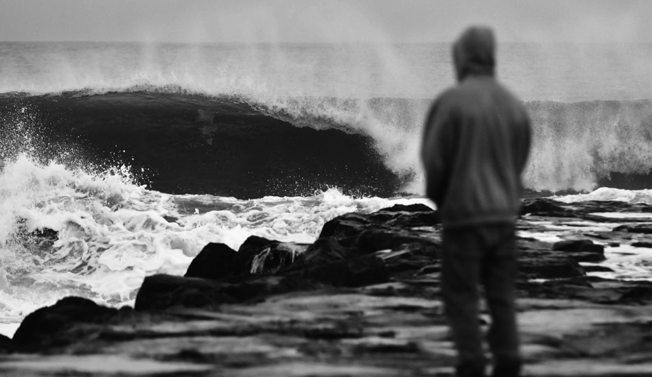 Surfer contemplating whether it’s worth it to run back to the truck and put on the 5 mil. Photo: <a href=\"http://jerseyshoreimages.com/about.html\">Robert Siliato</a>