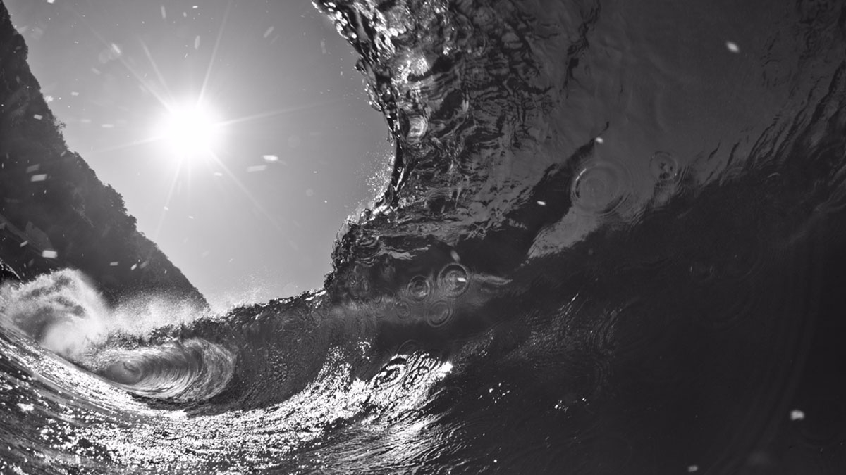 Intergalactic. This shot happened when I was trying a different angle at one of our secret beaches in Rio. The water spots created a \"sky full of stars\" effect in this B&W beauty. Photo: <a href=\"http://www.lucaswaterman.com/\">Lucas Gomes</a>