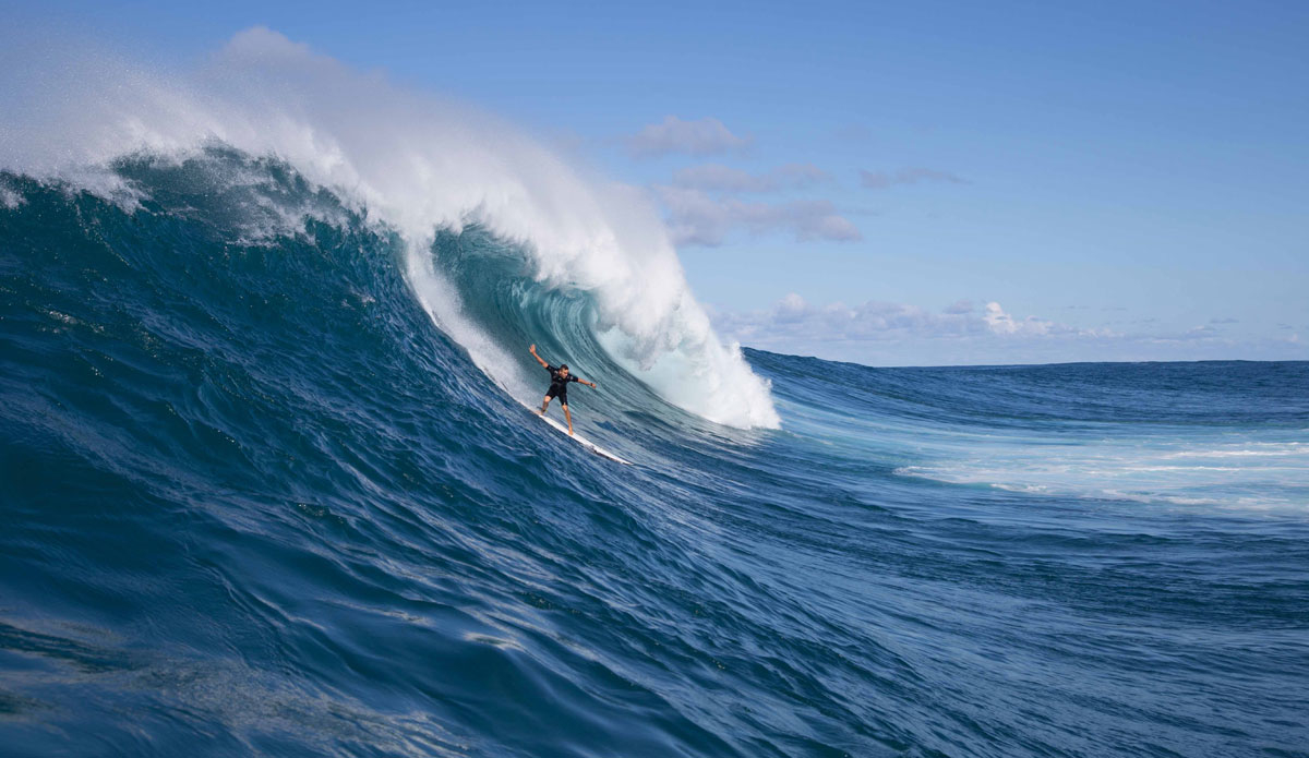 Nakoa Decoite dropping in on a near-vertical one.