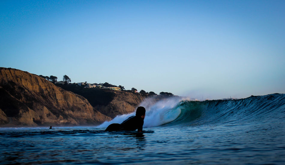 A surfer enjoys the view at Blacks. Photo: <a href=\"http://www.mattadenphotography.com\">Matt Aden</a>