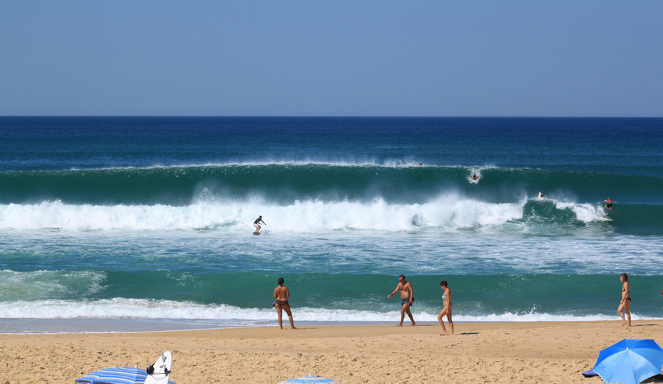 <strong>France.</strong>Summer time funfair. I think this picture represents what summer time surf in Le Landes is all about. Sunny, people laying on the beach and nice easy waves. Image: Sbrizzi