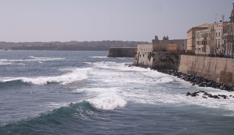 <strong>Italy.</strong> Surf and culture in the south. That was the last section of a nice right hander breaking in front of a historic town more than 2000 years old. Image: Sbrizzi