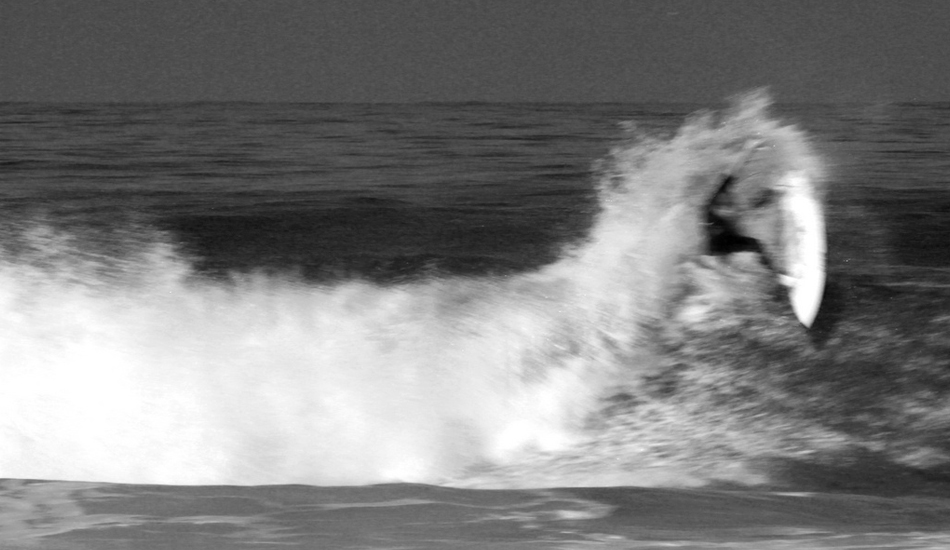 <strong>Portugal.</strong> C.J. Hobgood at Belgas. I love the blur on this picture. You can really feel the movements and the speed of this turn. Image: Sbrizzi