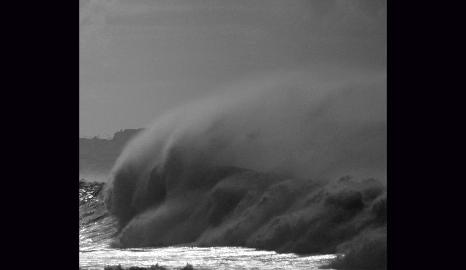 <strong>Morocco.</strong> A demonstration of Mother Nature. This was actually a huge wave. The amount of white water was impressive and the strong offshore wind was combing his lip. The black and white adds some drama on this incredible demonstration of Mother Nature. Image: Sbrizzi