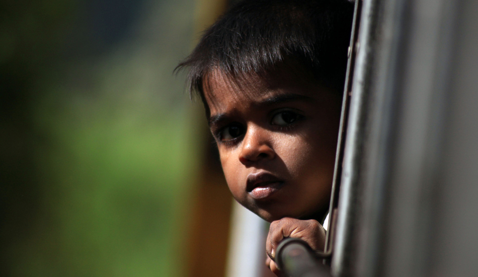 <strong>Sri Lanka.</strong> Curious Boy. This young boy spent the entire trip with his head outside the window looking around. He was so curious that after taking few pictures I went to see him showing the photos I took. Image: Sbrizzi