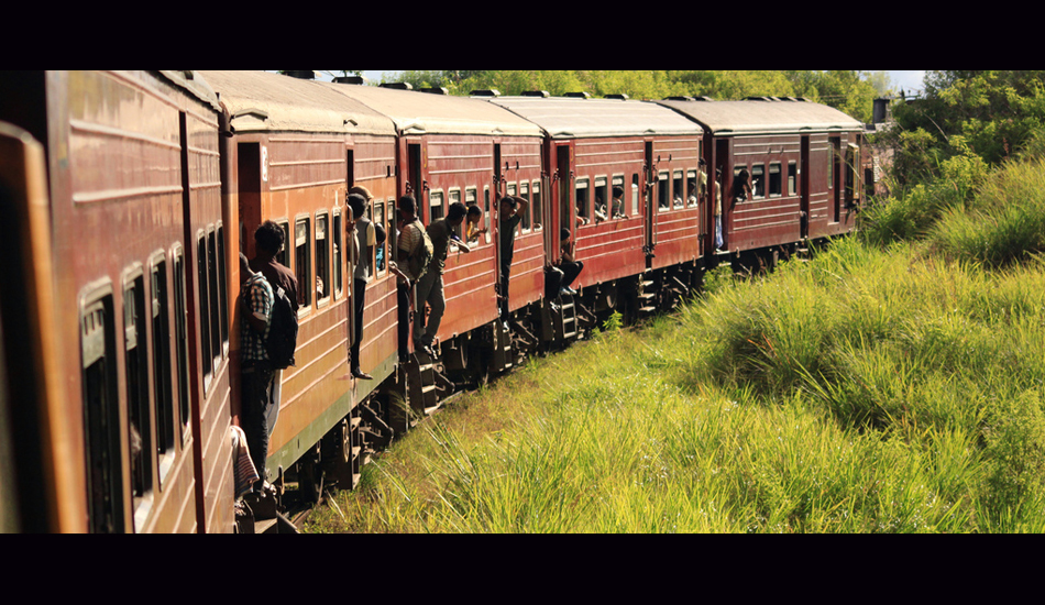 <strong>Sri Lanka.</strong> The best train trip ever. That was really an extra packed train. It was funny to see all the people putting their heads outside. Image: Sbrizzi