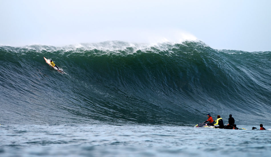 Ryan Seelbach paddles over a massive set wave at the 2014 Maverick\'s Invitational in Half Moon Bay, California. Photo: <a href=\"http://www.driftwoodfoto.com/\">Benjamin Ginsberg</a>