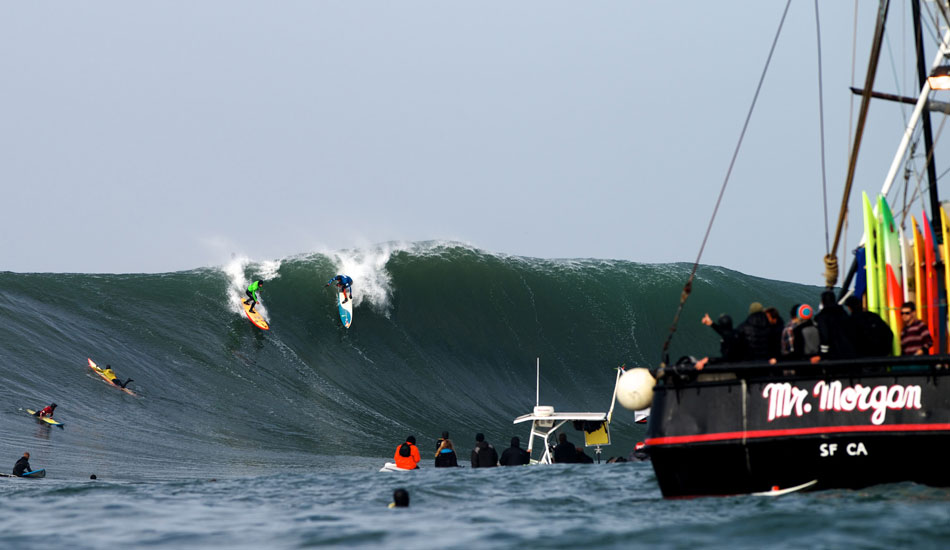 Peter Mel and Danilo Couto share a set wave at the 2014 Maverick\'s Invitational in Half Moon Bay, California. Photo: <a href=\"http://www.driftwoodfoto.com/\">Benjamin Ginsberg</a>