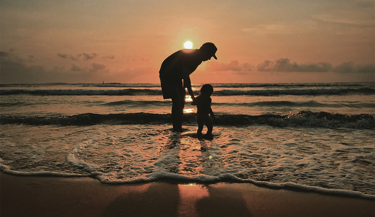 Event organizer and talented surfer Israel Preciado with his daughter Oliva. Photo Cyrus Sutton