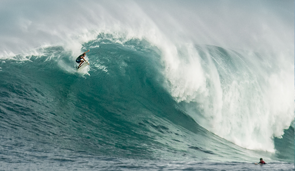 Wind up the face of a wave catches a board at Waimea.
 Photo: <a href=\"https://www.facebook.com/SCsurfshots\">Mike Healey</a>