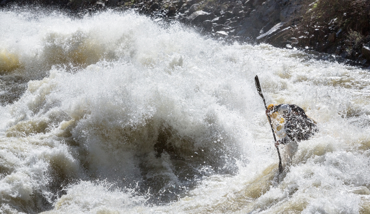 One rapid in particular that excites everyone who drives up Highway 55 is Juicer. This prominant and lengthy rapid is impressive at pretty much any flow. This spring has provided the NF with high water levels that we haven't experienced in 5+ years. At this flow, Juicer flexes itself into this impressive wave train. With one steep wave after the other its a ride that @smstoenner displays ever so perfectly with some air time. Kayakers gain plenty of speed on the river; descending a river like the North Fork requires great amounts of momentum to be able to punch through some of the massive wave-holes. With that comes the option to put in a perfectly timed stroke to boost yourself into the air.