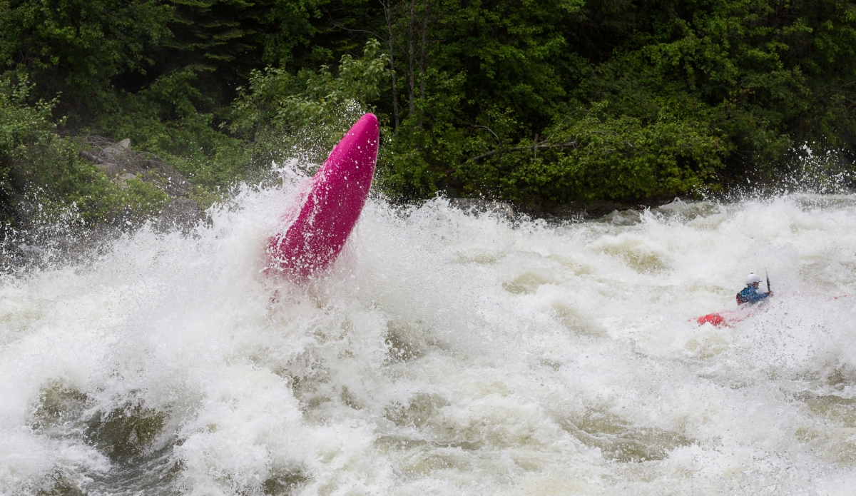 With high water comes unpredictable surges that can take hold of your kayak in ways you didn't think possible. @hunter_katt (pink boat) was where he needed to be in the rapid Disneyland, but nature timed things perfectly and when he collided with this wave it boosted him straight up. At this point, it is up to muscle memory to balance yourself correctly in a split second before you land back on the surface of the water. Hunter did just that and with a elated war cry he carried on paddling through the rapid.