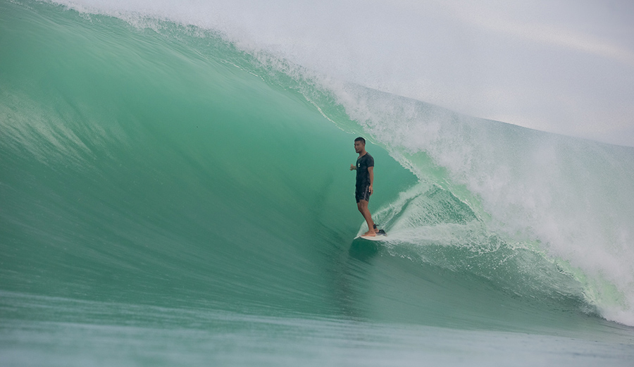 Having graduated from the broken boards left behind by visitors to the high performance boards of today, the Lagundri locals have developed a distinctive, confident style influenced by their traditional dance. Many of the locals who are born goofyfoot have been able to train themselves to switch foot with ease. Irawan Wau, here, takes advantage of the luck of being born a regular foot every time the wave breaks. 