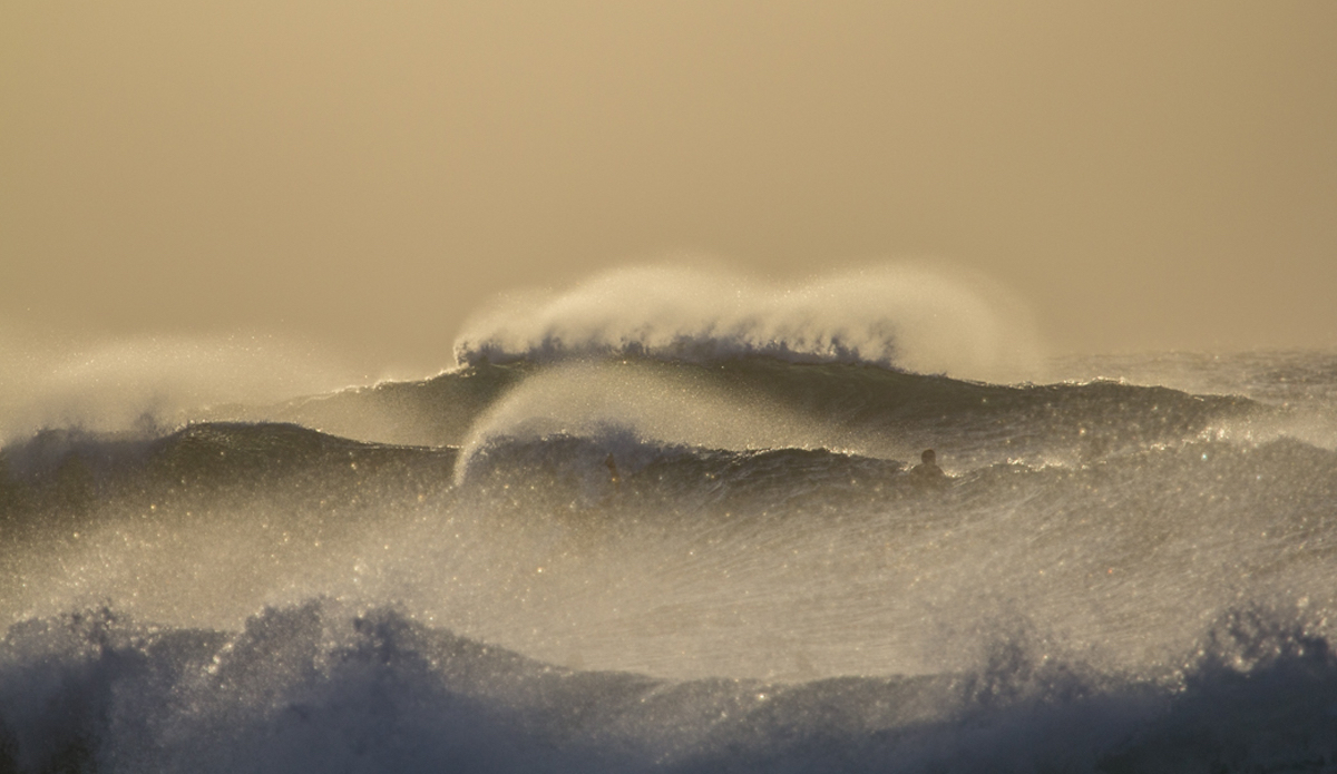 Maui Gold. I remember this was a hazy evening at Ho’okipa, as a new swell was coming in. The strong offshore winds made the spray look pretty cool. Photo: <a href=\"http://www.nickricca.com\">Nicks Ricca</a>