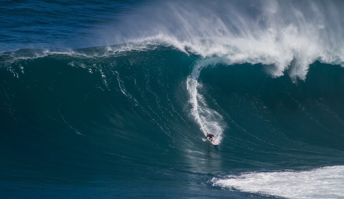 Twiggy on a Pe’ahi bomb. This swell was unreal and the level of performance just keeps getting higher and higher out there. Photo: <a href=\"http://www.nickricca.com\">Nicks Ricca</a>