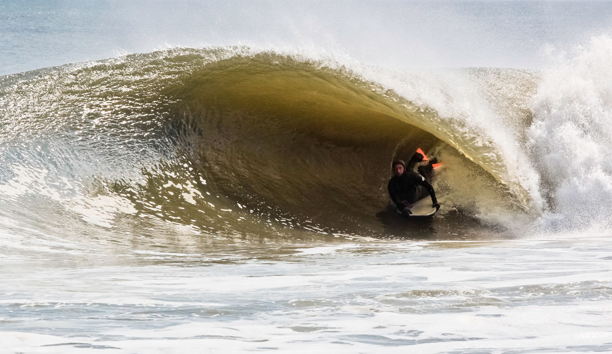 It looks inviting until you find out the water’s in the mid 30’s and the wave breaks in 2 feet of water. Not to mention the high for that day was 39 degrees. Anyway, here’s one of Brian Stoehr enjoying a cold one somewhere in Delaware. Photo: <a href=\"http://instagram.com/nicktribuno\">Nick Tribuno</a>