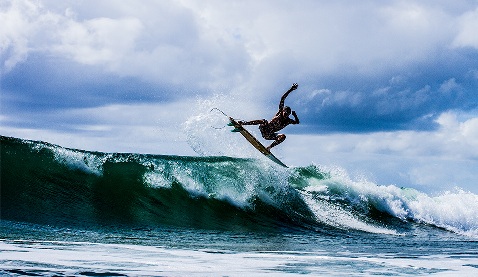 Jack Reginato throwing fins high. Photo: <a href=\"http://www.thetypewriterboy.com/\"> Nico Beighton</a>