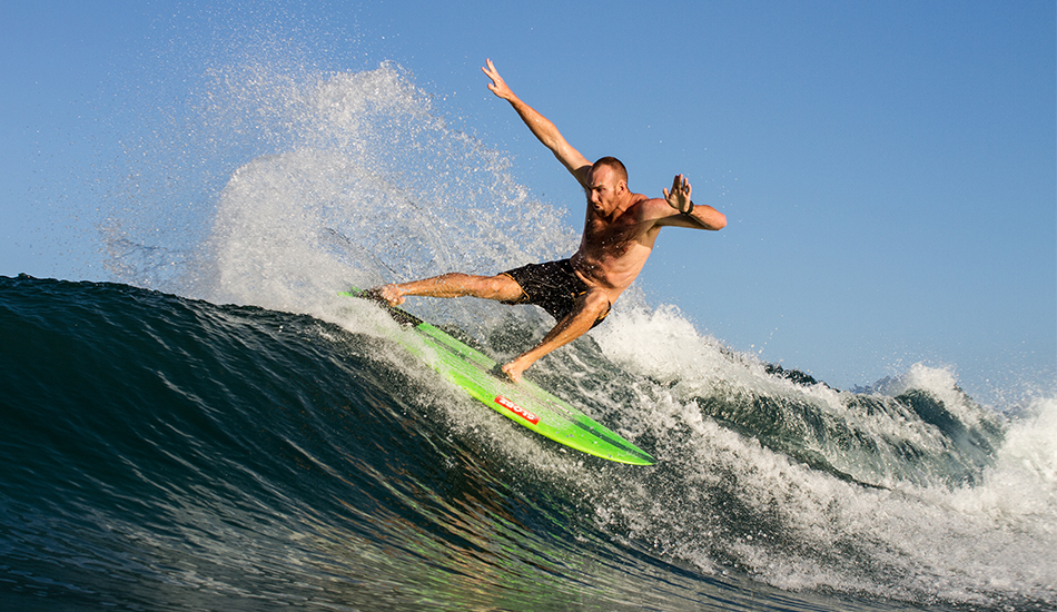 Blake Wilson board-sliding his way across glassy peaks. Photo: <a href=\"http://www.thetypewriterboy.com/\"> Nico Beighton</a>