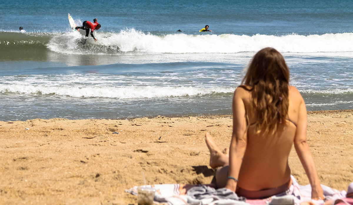 Not a bad view from the beach. Dallas Tolson with the rock-and-roll. Photo: John Streit